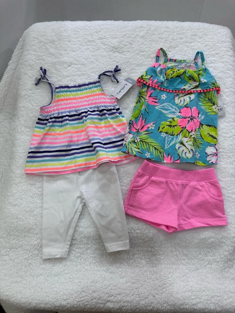Two infant girl’s Carter’s summer outfits